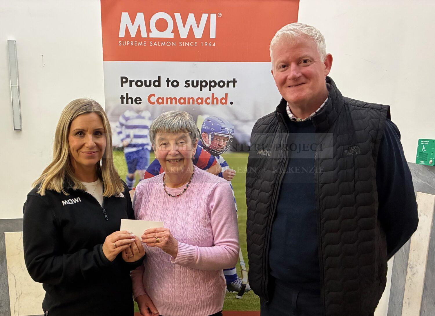 Featured image shows Valerie Nimmo receiving the £1,000 cheque from MOWI Community Engagement Officer Jayne MacKay(left) and MOWI Technical Director Dougie Hunter(right).